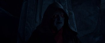 Movie still from “Star Wars: Episode IX - The Rise of Skywalker” (2019), directed by J.J. Abrams – An old man in a hooded jacket and a red scarf; Close Up shot, Over the shoulder angle