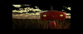 Movie still from “Star Wars: Episode IX - The Rise of Skywalker” (2019), directed by J.J. Abrams – A red robot in the middle of a grassy field; Extreme Close Up shot, Overhead angle