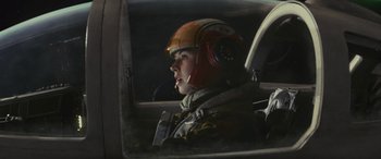 Movie still from “Star Wars: Episode VIII - The Last Jedi” (2017), directed by Rian Johnson – A person in a helicopter wearing a helmet; Close Up shot, Low angle