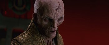 Movie still from “Star Wars: Episode VIII - The Last Jedi” (2017), directed by Rian Johnson – An old man with a bald head is looking at the camera; Close Up shot, Low angle