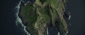 Movie still from “Star Wars: Episode VIII - The Last Jedi” (2017), directed by Rian Johnson – An aerial view of a cliff with a bridge on it's side; Extreme Wide shot, Overhead angle