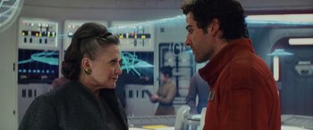 Movie still from “Star Wars: Episode VIII - The Last Jedi” (2017), directed by Rian Johnson – A woman and a man are talking to each other; Close Up shot, Over the shoulder angle
