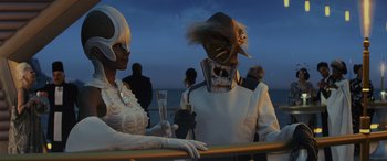Movie still from “Star Wars: Episode VIII - The Last Jedi” (2017), directed by Rian Johnson – A man and a woman dressed in white and holding champagne; Medium shot, Over the shoulder angle