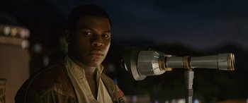 Movie still from “Star Wars: Episode VIII - The Last Jedi” (2017), directed by Rian Johnson – A man standing in front of a telescope; Close Up shot, Low angle