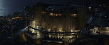 Movie still from “Star Wars: Episode VIII - The Last Jedi” (2017), directed by Rian Johnson – A building that has been lit up at night; Extreme Wide shot, Low angle