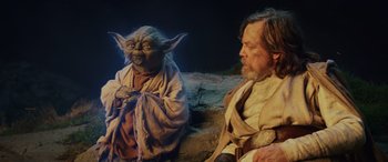 Movie still from “Star Wars: Episode VIII - The Last Jedi” (2017), directed by Rian Johnson – A man sitting next to a woman with a star wars costume on; Medium shot, Over the shoulder angle