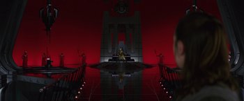 Movie still from “Star Wars: Episode VIII - The Last Jedi” (2017), directed by Rian Johnson – A woman sitting on a throne in a red room; Extreme Wide shot, Low angle