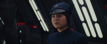 Movie still from “Star Wars: Episode VIII - The Last Jedi” (2017), directed by Rian Johnson – A woman wearing a blue uniform and a blue hat; Close Up shot, Low angle