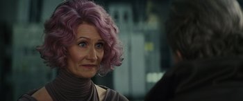 Movie still from “Star Wars: Episode VIII - The Last Jedi” (2017), directed by Rian Johnson – A person with purple hair; Close Up shot, Over the shoulder angle