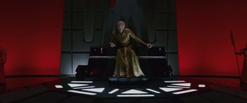 Movie still from “Star Wars: Episode VIII - The Last Jedi” (2017), directed by Rian Johnson – A man dressed in a yellow robe and a pink wig; Wide shot, Low angle