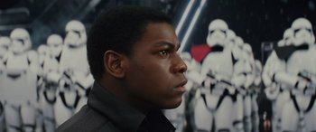 Movie still from “Star Wars: Episode VIII - The Last Jedi” (2017), directed by Rian Johnson – A person in front of a wall; Close Up shot, Over the shoulder angle