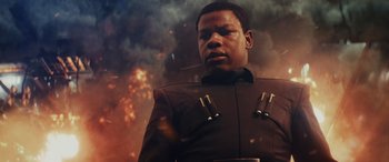 Movie still from “Star Wars: Episode VIII - The Last Jedi” (2017), directed by Rian Johnson – An image of a man that is in the air; Close Up shot, Low angle