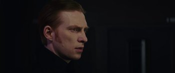 Movie still from “Star Wars: Episode VIII - The Last Jedi” (2017), directed by Rian Johnson – A person wearing a black shirt; Close Up shot, Over the shoulder angle
