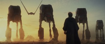 Movie still from “Star Wars: Episode VIII - The Last Jedi” (2017), directed by Rian Johnson – A man and a woman looking at an at - at walker; Wide shot, Low angle