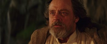 Movie still from “Star Wars: Episode VIII - The Last Jedi” (2017), directed by Rian Johnson – An older man with a beard and a mustache; Close Up shot, Over the shoulder angle