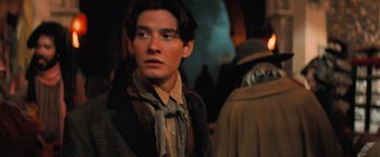 Movie still from “Stardust” (2007), directed by Matthew Vaughn – A young man wearing a hat and a tie; Close Up shot, Over the shoulder angle