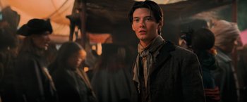 Movie still from “Stardust” (2007), directed by Matthew Vaughn – A man in a brown jacket and a brown scarf; Close Up shot, Over the shoulder angle