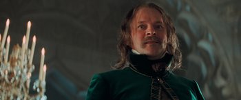 Movie still from “Stardust” (2007), directed by Matthew Vaughn – A person with long hair and a mustache; Close Up shot, Low angle