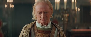 Movie still from “Stardust” (2007), directed by Matthew Vaughn – An old man with blonde long hair and a beard; Close Up shot, Over the shoulder angle