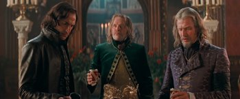 Movie still from “Stardust” (2007), directed by Matthew Vaughn – A man in a green jacket holding a drink; Medium shot, Over the shoulder angle