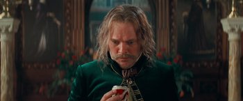 Movie still from “Stardust” (2007), directed by Matthew Vaughn – A person wearing a suit and tie; Close Up shot, Low angle