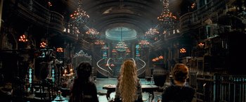 Movie still from “Stardust” (2007), directed by Matthew Vaughn – A group of people standing in front of an ornate building; Wide shot, Low angle