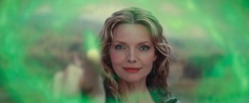 Movie still from “Stardust” (2007), directed by Matthew Vaughn – A woman with long blonde curly hair wearing a green dress; Close Up shot, Low angle