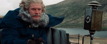 Movie still from “Stardust” (2007), directed by Matthew Vaughn – A man with a long beard and a fur trimmed coat; Close Up shot, Over the shoulder angle
