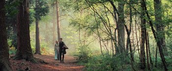 Movie still from “Stardust” (2007), directed by Matthew Vaughn – A man and a woman walking through the woods; Wide shot, High angle