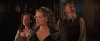 Movie still from “Stardust” (2007), directed by Matthew Vaughn – A woman with long curly hair wearing a black jacket; Close Up shot, Over the shoulder angle