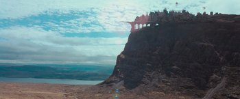 Movie still from “Stardust” (2007), directed by Matthew Vaughn – A castle on top of a mountain with a sky background; Extreme Wide shot, Low angle