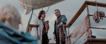 Movie still from “Stardust” (2007), directed by Matthew Vaughn – Two men standing on a deck talking to each other; Medium shot, Over the shoulder angle