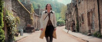 Movie still from “Stardust” (2007), directed by Matthew Vaughn – A man in a long coat walking down a street; Medium shot, Low angle