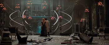 Movie still from “Stardust” (2007), directed by Matthew Vaughn – Two people standing in front of a staircase in a room filled with debris; Wide shot, High angle