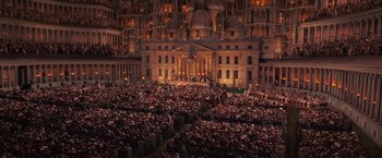 Movie still from “Stardust” (2007), directed by Matthew Vaughn – A crowd of people standing in front of a large building; Extreme Wide shot, High angle