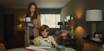 Movie still from “Stargirl” (2020), directed by Julia Hart – A woman and a boy in a living room; Medium shot, Over the shoulder angle