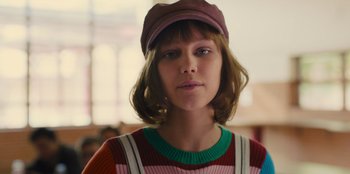 Movie still from “Stargirl” (2020), directed by Julia Hart – A young woman wearing a hat and a sweater; Close Up shot, Low angle