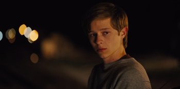 Movie still from “Stargirl” (2020), directed by Julia Hart – A young boy is looking into the camera; Close Up shot, Over the shoulder angle