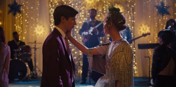 Movie still from “Stargirl” (2020), directed by Julia Hart – A man and a woman in formal wear touching each other's face; Medium shot, Over the shoulder angle