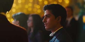 Movie still from “Stargirl” (2020), directed by Julia Hart – A young man looking to his left in front of a group of people; Close Up shot, Low angle