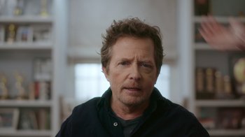 Movie still from “Still: A Michael J. Fox Movie” (2023), directed by Davis Guggenheim – A person wearing a black shirt; Close Up shot, Low angle