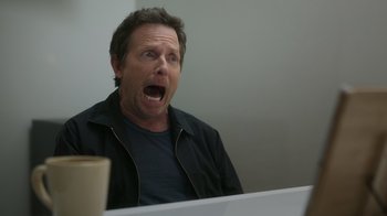 Movie still from “Still: A Michael J. Fox Movie” (2023), directed by Davis Guggenheim – A man is sitting in front of a computer; Close Up shot, Over the shoulder angle