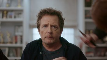Movie still from “Still: A Michael J. Fox Movie” (2023), directed by Davis Guggenheim – A person wearing a shirt; Close Up shot, Over the shoulder angle