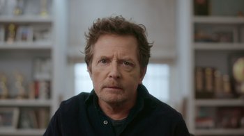 Movie still from “Still: A Michael J. Fox Movie” (2023), directed by Davis Guggenheim – A person wearing a black shirt; Close Up shot, Low angle