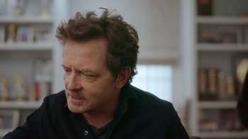 Movie still from “Still: A Michael J. Fox Movie” (2023), directed by Davis Guggenheim – A person wearing a black shirt; Close Up shot, Over the shoulder angle