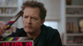 Movie still from “Still: A Michael J. Fox Movie” (2023), directed by Davis Guggenheim – A person holding a knife; Close Up shot, Over the shoulder angle