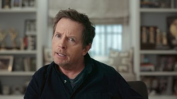 Movie still from “Still: A Michael J. Fox Movie” (2023), directed by Davis Guggenheim – A person wearing a black shirt; Close Up shot, Over the shoulder angle