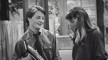 Movie still from “Still: A Michael J. Fox Movie” (2023), directed by Davis Guggenheim – A man and a woman talking to each other; Close Up shot, Over the shoulder angle