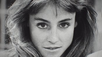 Movie still from “Still: A Michael J. Fox Movie” (2023), directed by Davis Guggenheim – Black and white photograph of a young woman's face; Extreme Close Up shot, High angle