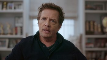 Movie still from “Still: A Michael J. Fox Movie” (2023), directed by Davis Guggenheim – A person wearing a black shirt; Close Up shot, Over the shoulder angle